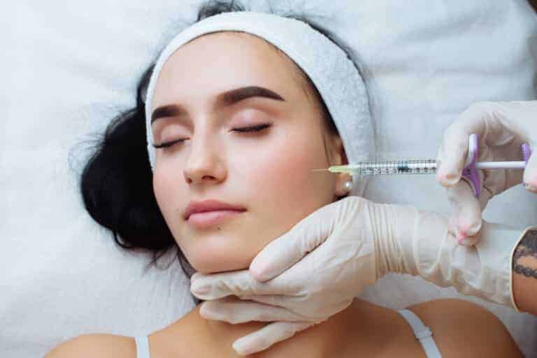 Provider administering a dermal filler injection